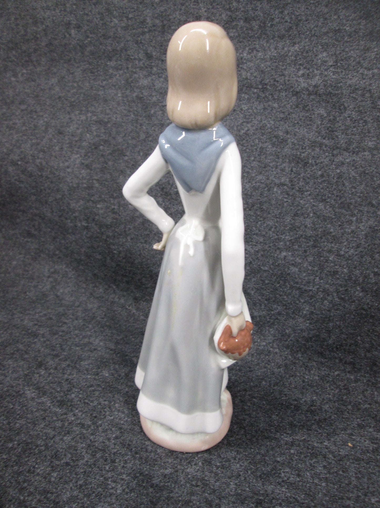 08259 - Cascades Porcelain Figurine Woman Holding Basket